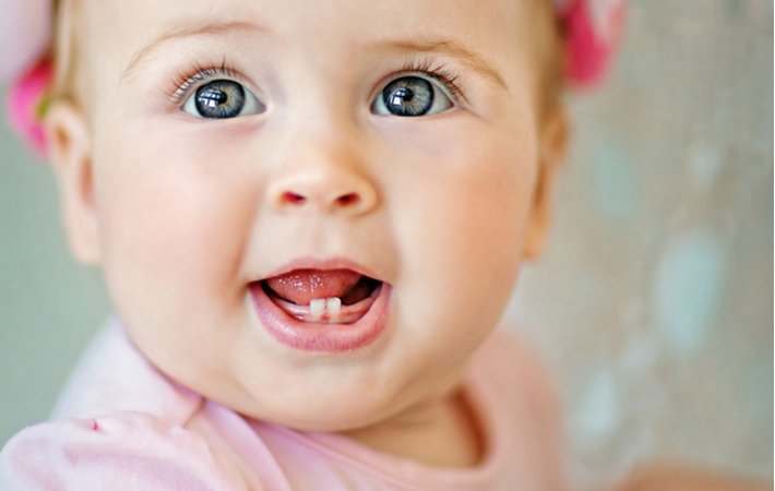 baby with first two teeth