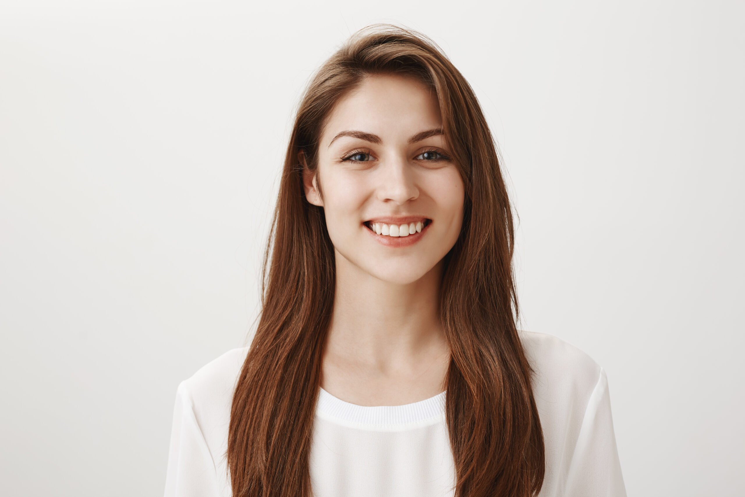 friendly smiling woman looking pleased front scaled